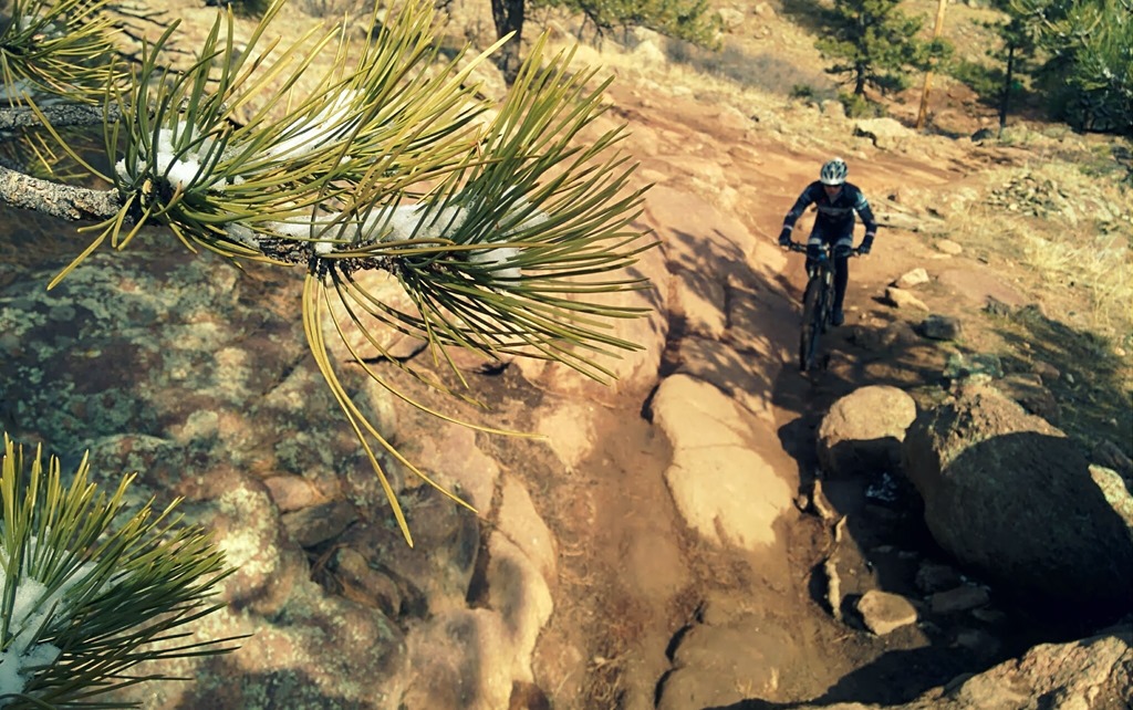Like normal, the snow didn't hang around for long. The Colorado sun did its best to burn the ground dry again, so Bryan and I headed up to Hall Ranch in Lyons for some trail time. I haven't ridden this trail for a while, and it made me suffer. It's regarded as one of the hardest around the Front Range, and thats on a dry day. This time around, we had wet sand on slippery rocks to contend this. The Ponderosa Pines which are common in the foothills were holding on to little pockets of snow; each time the wind blew, we'd get a mini snow storm between the rays of sunlight. 