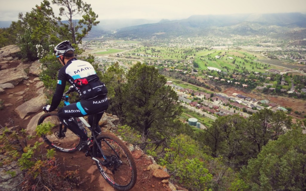 Bryan riding Raiders Ridge above downtown Durango. The rain made it an extra challenge