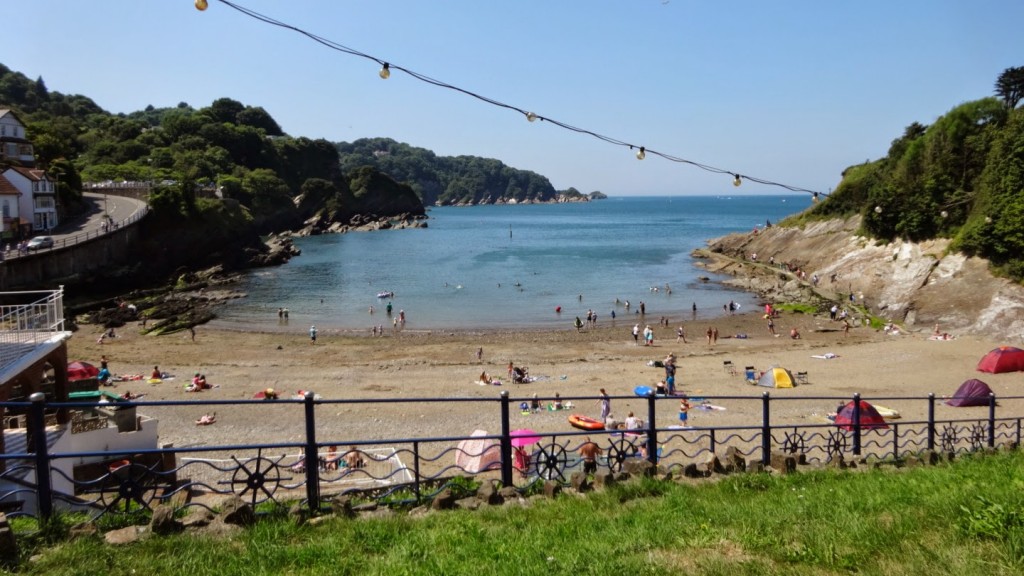 Combe Martin Beach in August. The sheltered cove and warm water means it's one of the best swimming beaches along the coast